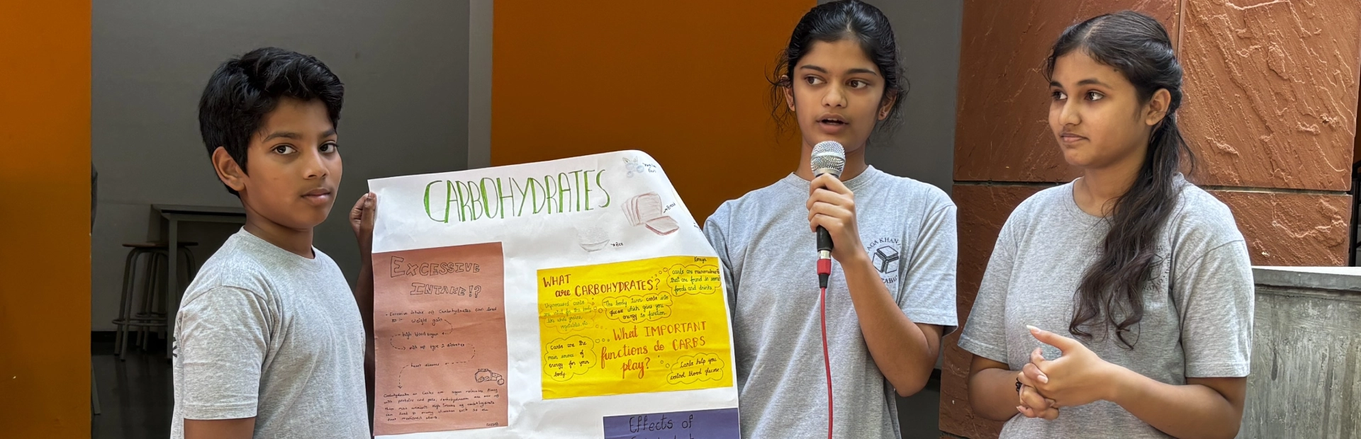 Grade 7 students showcasing their work.